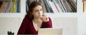Young woman thinking about buying health insurance